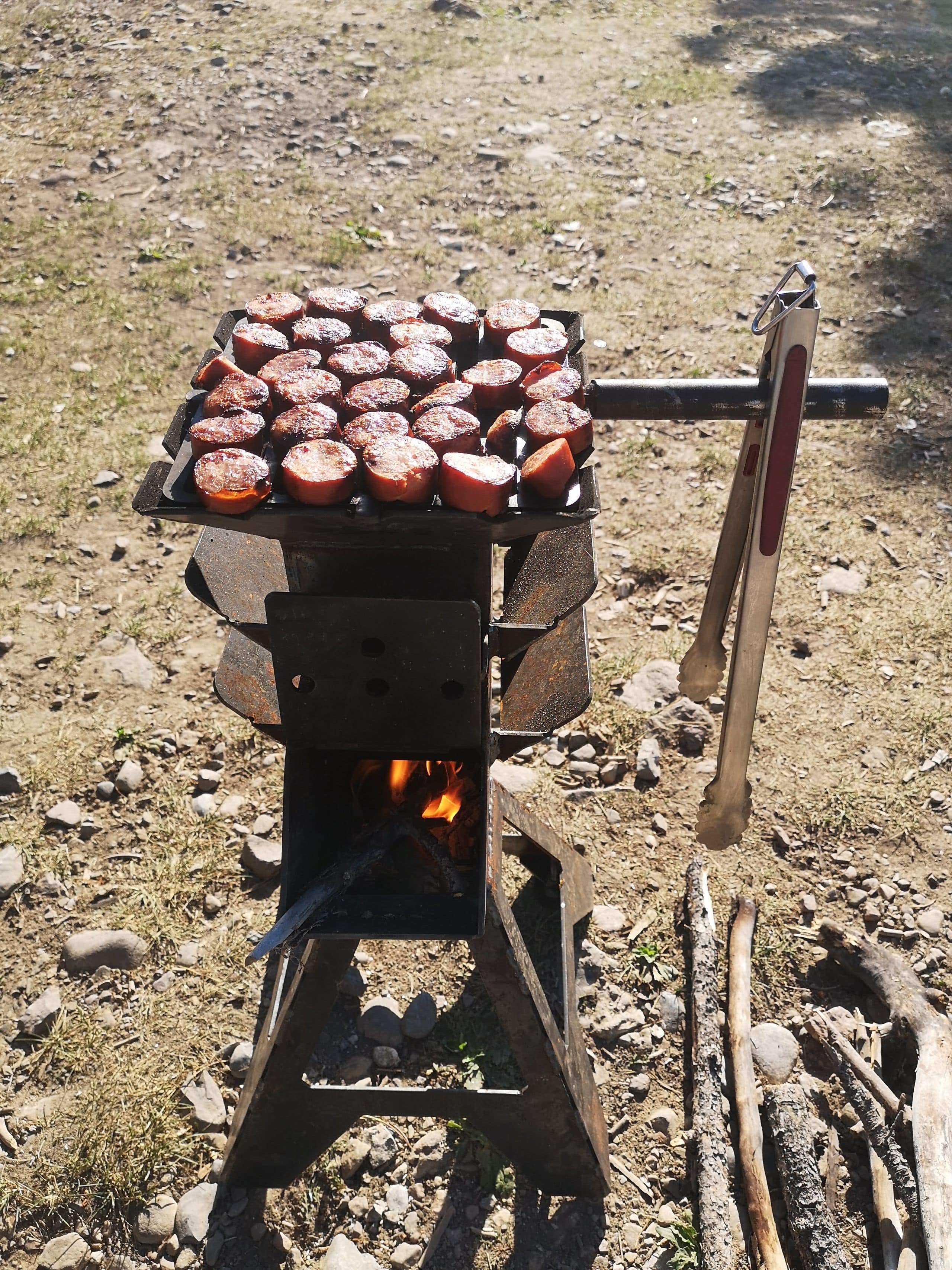 rocket stove cooking burgers outside