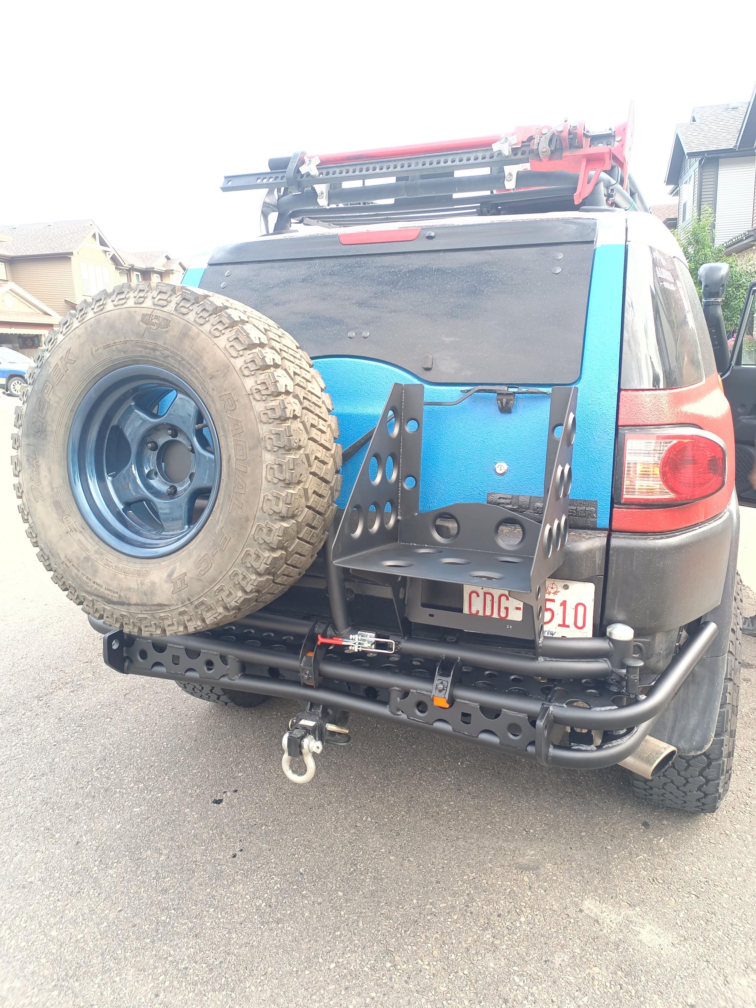 Custom off-road dual swingout tube race bumper with dual gas can holder for Toyota FJ Cruiser